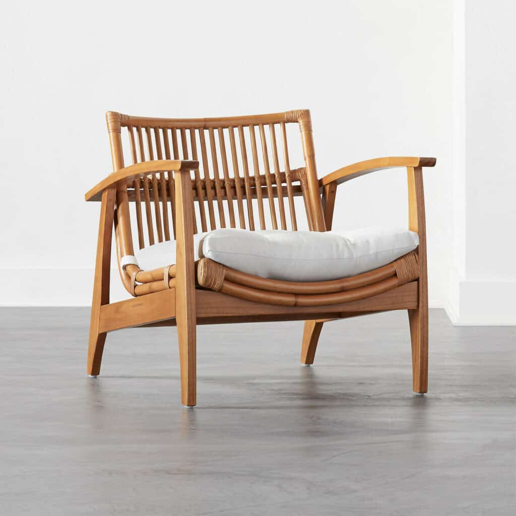 Noelie rattan lounge chair with white cushion - 22 natural homeware pieces that are both trendy and timeless